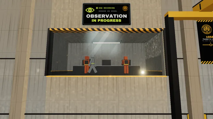 Technicians in orange suits behind a one way observation window.