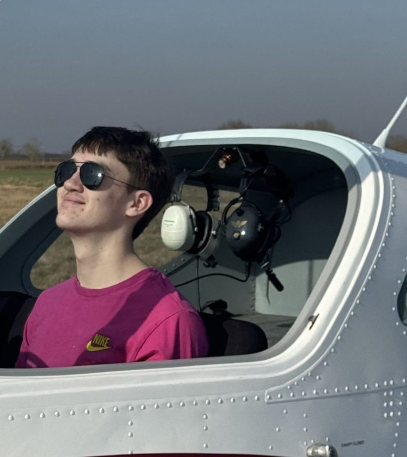 Arthur sitting in the cockpit of a light aircraft